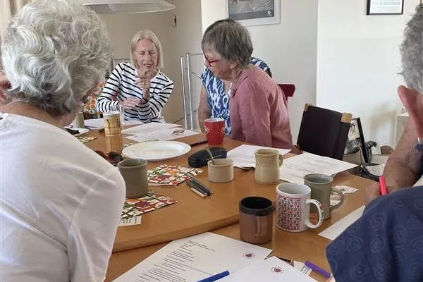 Close up of a group of senior people having a discussion